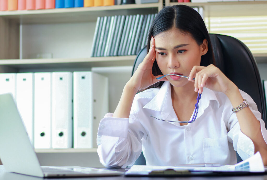 Portrait of Asian woman that sitting in the office thinking about marketing